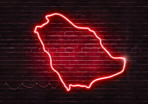 Neon sign on a brick wall in the shape of Saudi Arabia.(illustration series)