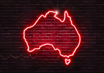 Neon sign on a brick wall in the shape of Australia.(illustration series)