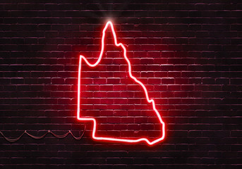 Neon sign on a brick wall in the shape of Queensland.(illustration series)