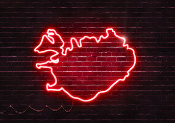 Neon sign on a brick wall in the shape of Iceland.(illustration series)