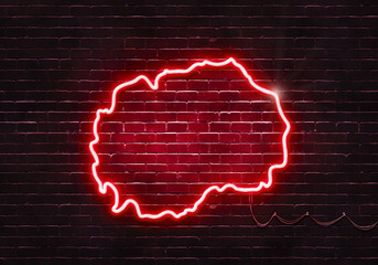 Neon sign on a brick wall in the shape of Macedonia.(illustration series)
