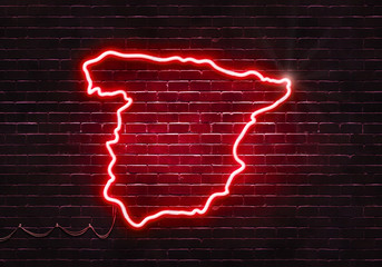 Neon sign on a brick wall in the shape of Spain.(illustration series)