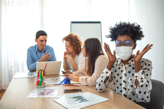 Employees working in business office while wearing medical face mask for protecting and preventing the infection of corona virus disease or covid-19. Business people fearing swineflu virus