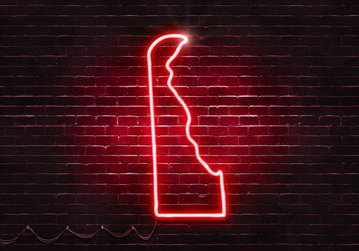 Neon sign on a brick wall in the shape of Delaware.(illustration series)