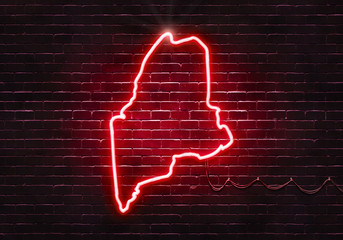 Neon sign on a brick wall in the shape of Maine.(illustration series)