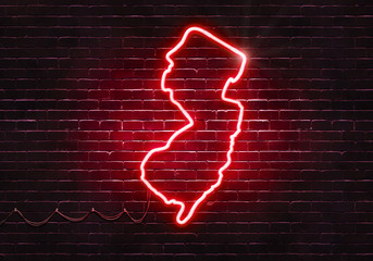 Neon sign on a brick wall in the shape of New Jersey.(illustration series)