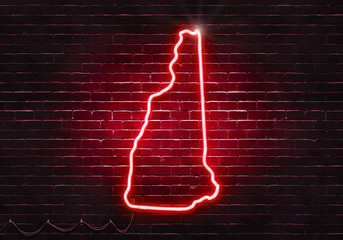 Neon sign on a brick wall in the shape of New Hampshire.(illustration series)