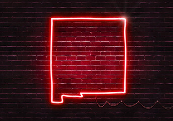 Neon sign on a brick wall in the shape of New Mexico.(illustration series)