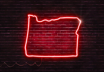 Neon sign on a brick wall in the shape of Oregon.(illustration series)