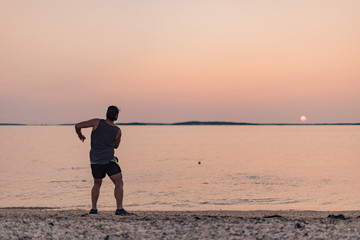 Fototapeta premium Skipping stones at sunset