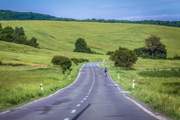 Bicyclist on a empty road in Slovakia