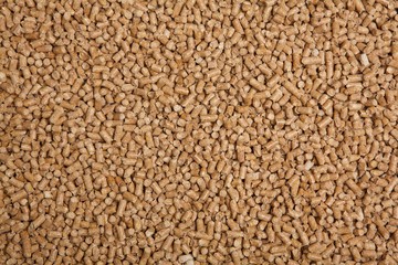 Wooden pellets. Alternative heating in winter. Texture of house pellets for heating. Ecologically energy. Wood background.
