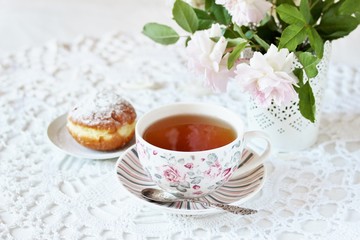 Fototapeta na wymiar A tea party in the style of Shabby Chic. tea in the beautiful tea steam with a pattern 