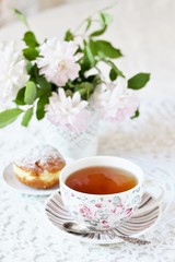 A tea party  in the style of Shabby Chic. tea in the beautiful tea steam with a pattern 
