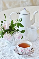 A tea party  in the style of Shabby Chic. tea in the beautiful tea steam with a pattern 