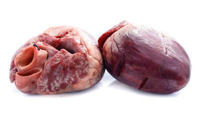 raw pig heart close-up isolated on white background
