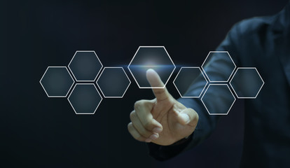 Businessman pointing his finger touch hexagon icon