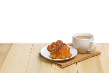 Coffee and croissants on the wood