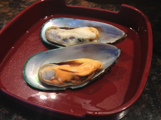Raw Mussel sliced pieces on  dish