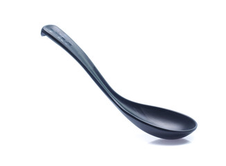 plastic black spoon, isolated on white background