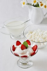 cheese cream. whipped curd cream with strawberries. Homemade cottage cheese is whipped with cream. Chamomile flowers. A useful dessert. On a light background.