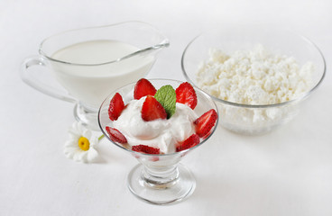 cheese cream. whipped curd cream with strawberries. Homemade cottage cheese is whipped with cream. Chamomile flowers. A useful dessert. On a light background.
