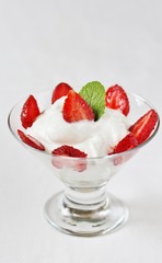 cheese cream. whipped curd cream with strawberries. Homemade cottage cheese is whipped with cream. Chamomile flowers. A useful dessert. On a light background.