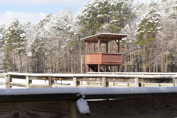 An equestrian scoring booth beside an outside arena in Newport News Park following a winter snow storm.