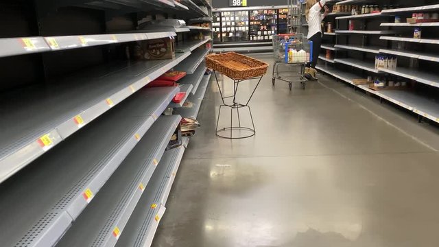 Supermarket with empty food shelves