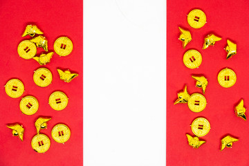 Accessories golden coins Gold Ingot with words for lucky, good fortune, and happiness decoration on red background with copy space for text , Happy Chinese new year or lunar new year vacation concept.