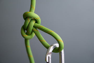butterfly knot green climbing rope clipped carabiner
