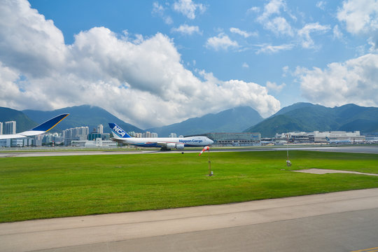 HONG KONG, CHINA - CIRCA APRIL, 2019: Hong Kong International Airport seen from Singapore Airlines Airbus A350.
