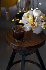 transparent glass of iced black coffee or americano on wooden table