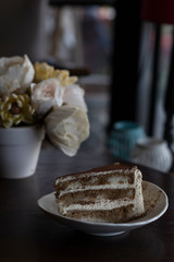 closeup tiramisu cake at coffee shop in a wooden table
