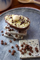 Delicious chocolate Easter eggs on gray background