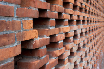 Red brick wall with abstract shape and patterns in the daytime