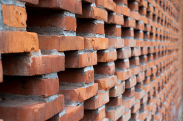 Red brick wall with abstract shape and patterns in the daytime