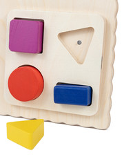 Photo of a wooden toy  children's sorter with small wooden details in the form of geometric shapes (square, circle, rectangle , triangle), in different colors  on a white isolated background