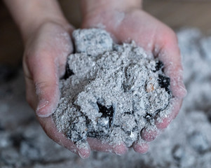 burnt ashes in a child 's hand