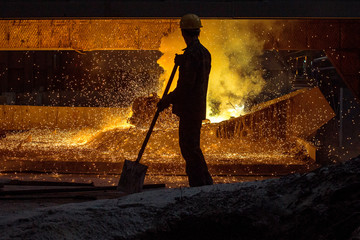 Smelting metal in a metallurgical plant.