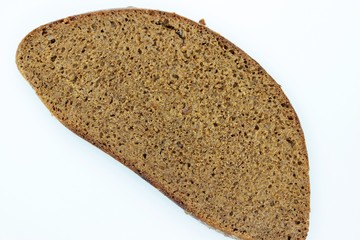 A piece of black rye bread smelted on a white background