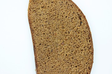 A piece of black rye bread smelted on a white background
