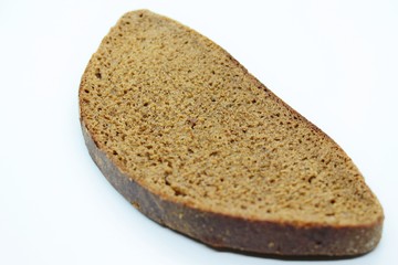A piece of black rye bread smelted on a white background