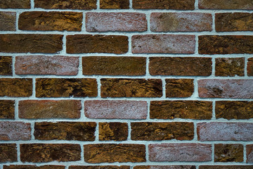 Brick wall made of textured decorative brick.