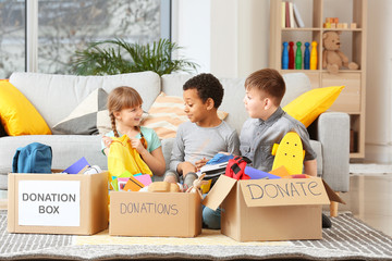 Little children with donations at orphan home
