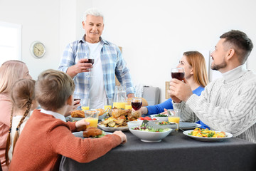 Family celebrating Thanksgiving Day at home