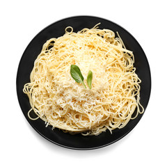 Plate with tasty pasta and cheese on white background