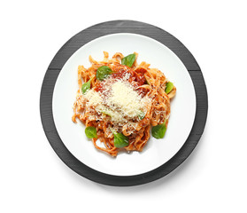 Plate with tasty pasta and cheese on white background