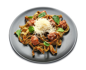 Plate with tasty pasta and cheese on white background
