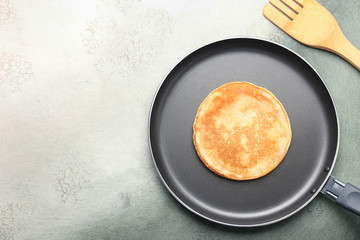 Preparing of tasty pancakes in frying pan